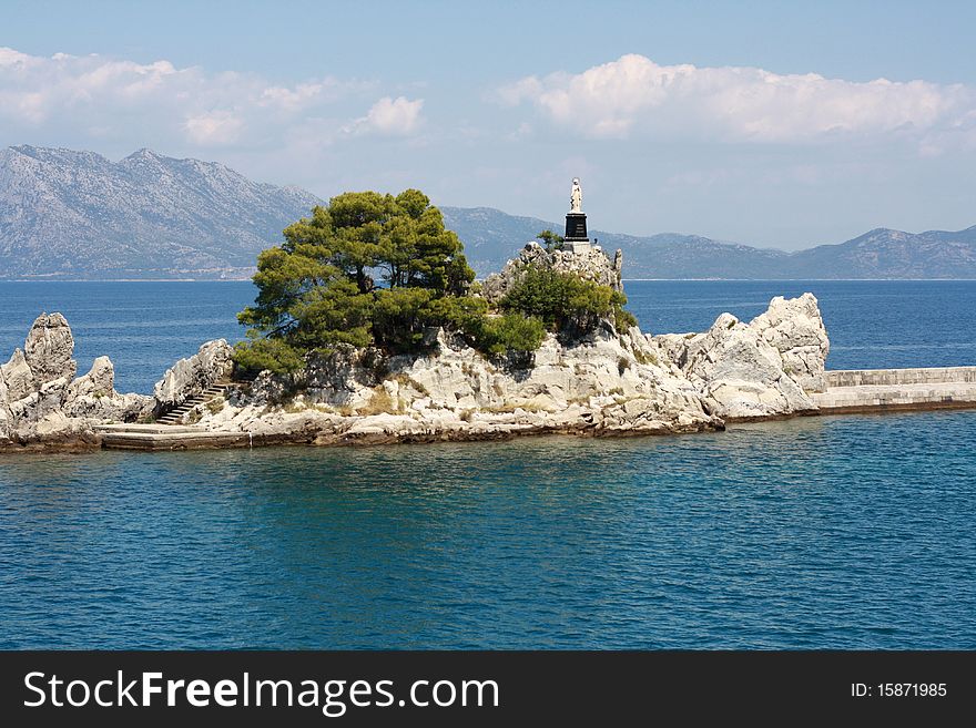 Landscape of white roks whit statue of Holy Lady in small town in in south eastern Croatia. Landscape of white roks whit statue of Holy Lady in small town in in south eastern Croatia