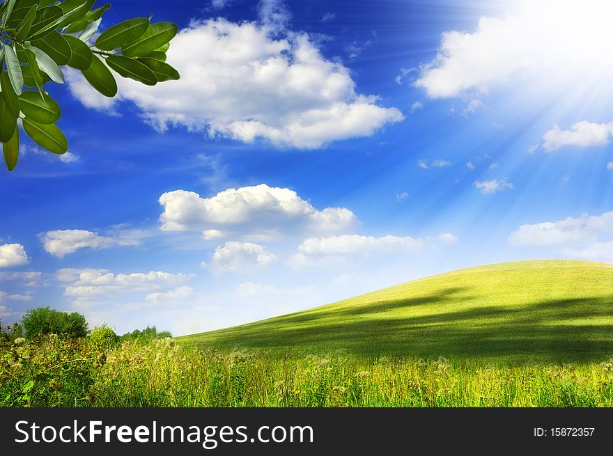 View of nice green hill on blue sky background. View of nice green hill on blue sky background