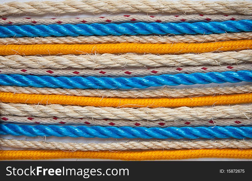 A selection of ropes arranged on a white background. A selection of ropes arranged on a white background.
