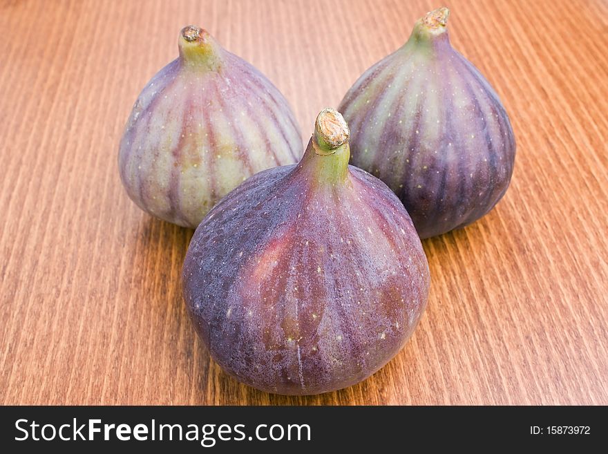 Three delicious fresh ripe figs close-up