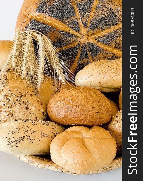 Fresh bread in the basket on the white background