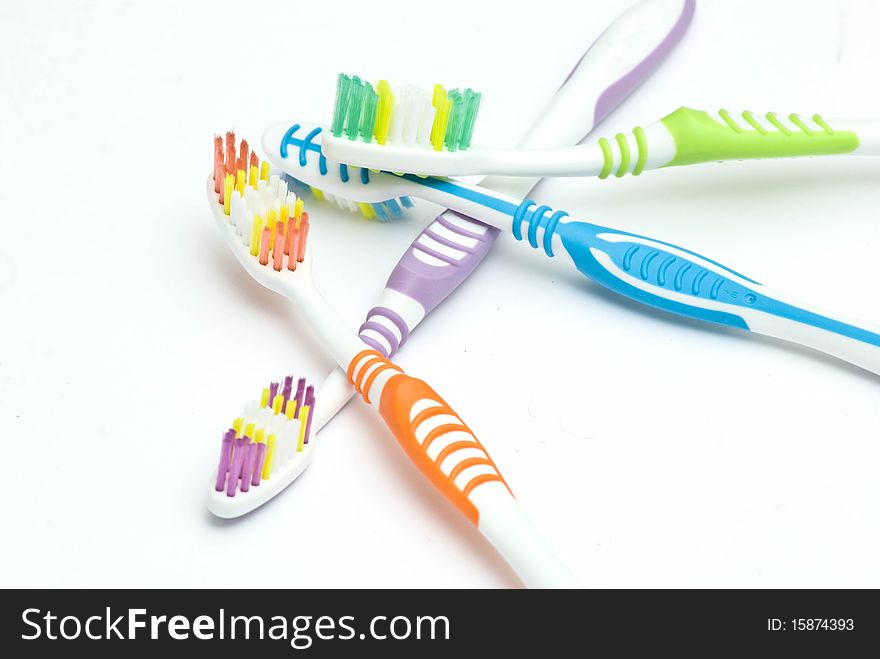 Colourful toothbrushes on the white background