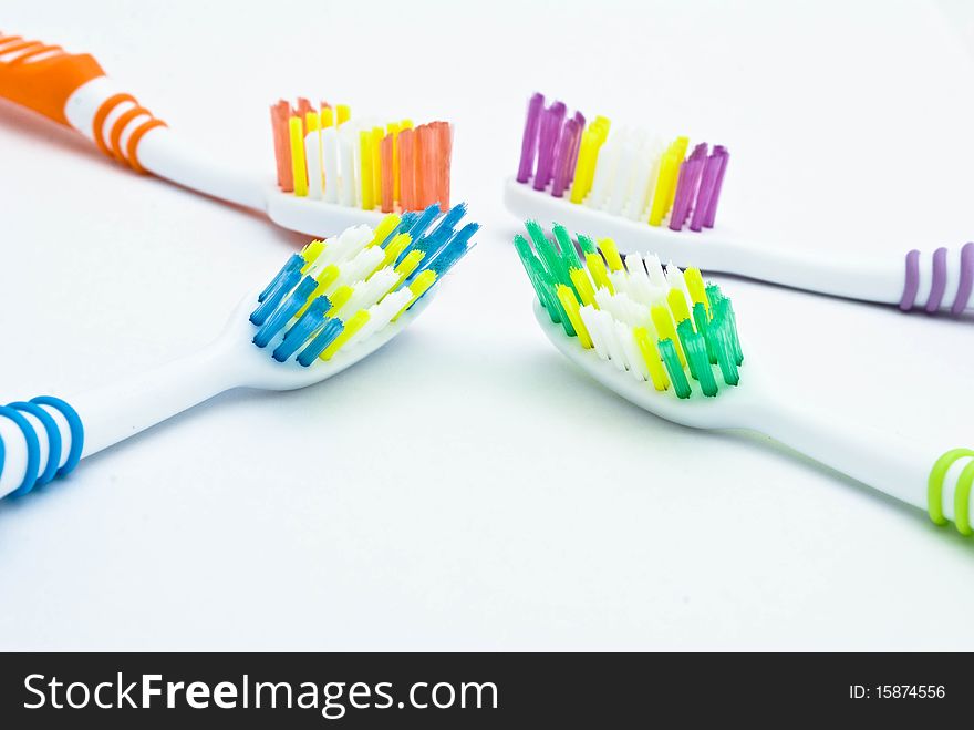 Colourful toothbrushes on the white background