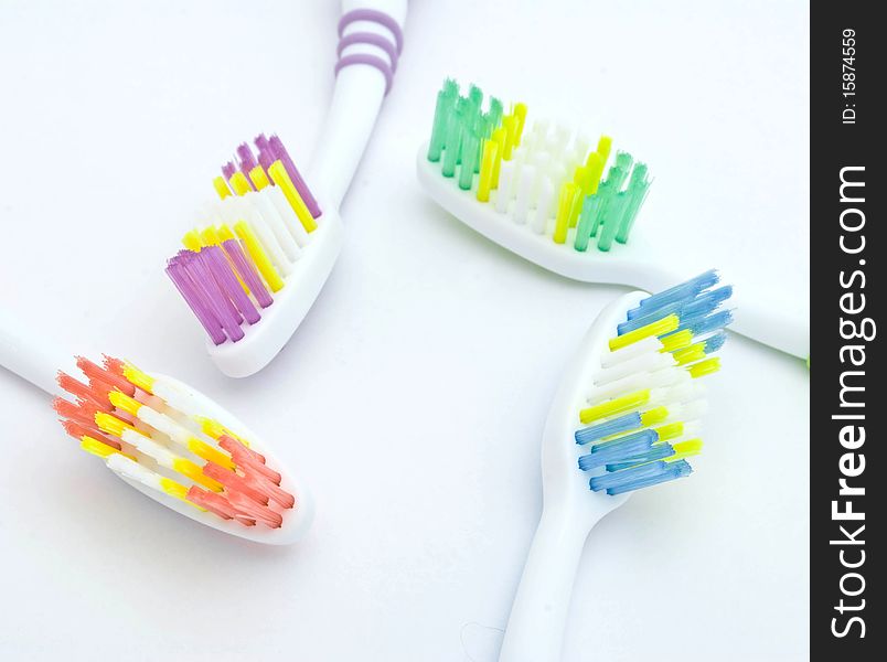 Colourful toothbrushes on the white background