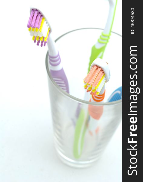 Colourful toothbrushes on the white background