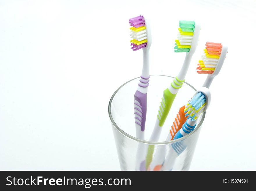 Colourful toothbrushes on the white background