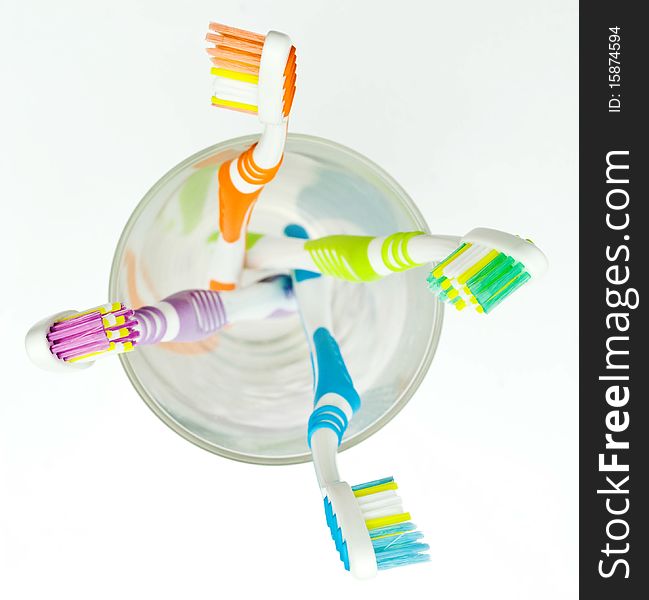 Colourful toothbrushes on the white background