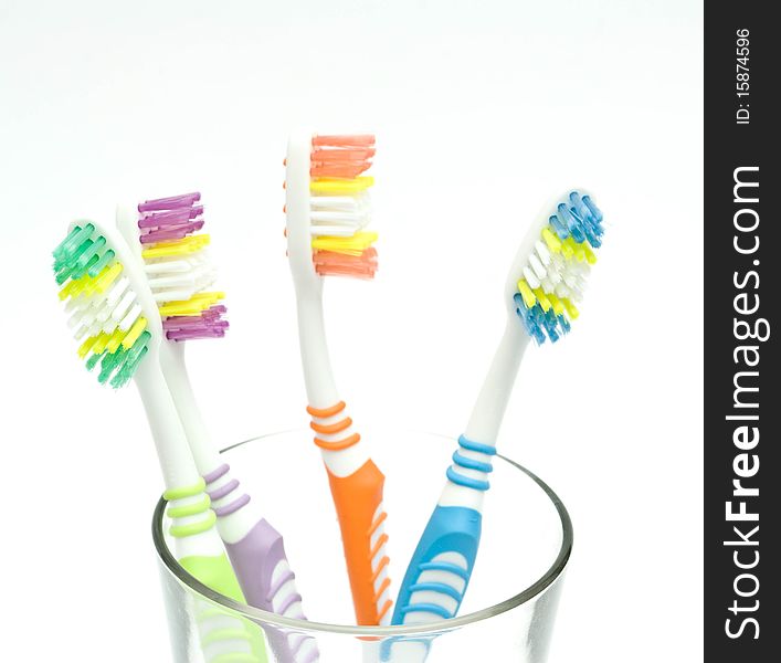 Colourful toothbrushes on the white background