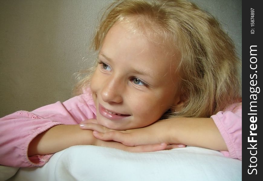Blonde  smiling girl Has a rest lying on hands. Blonde  smiling girl Has a rest lying on hands.