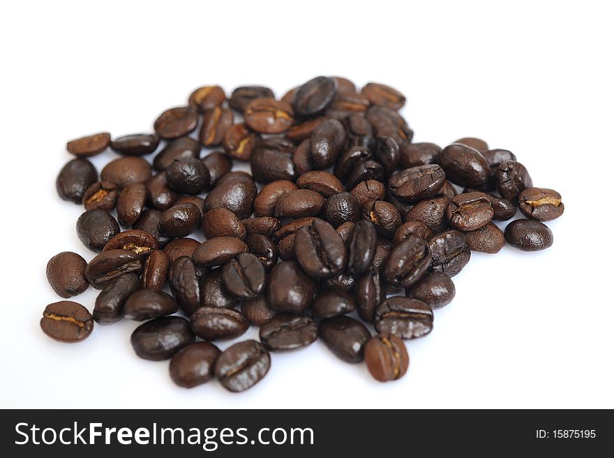 Coffee beans close-up in white background.