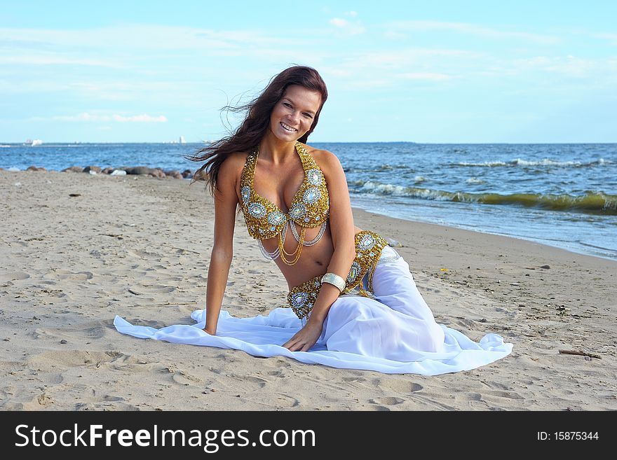 Beautiful Sitting Woman In Exotic Dress