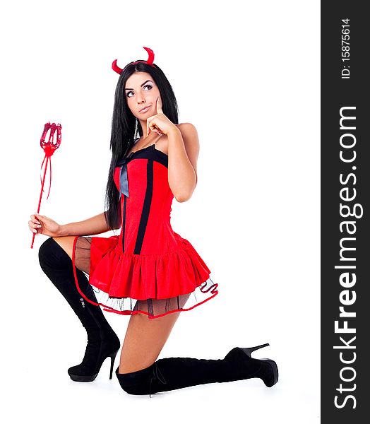 Sexy brunette girl wearing a halloween costume of an imp