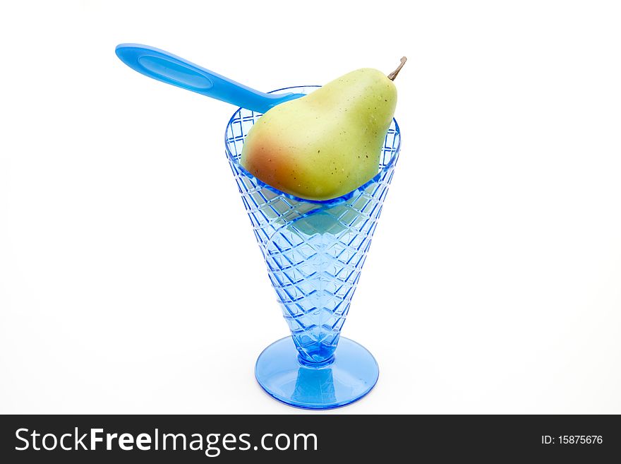 Pear in the plastic ice cup with spoon