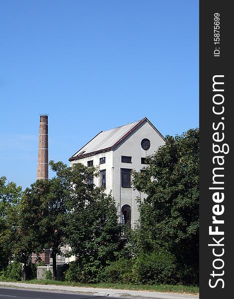 Old factory sawmill with tall chimney. Old factory sawmill with tall chimney