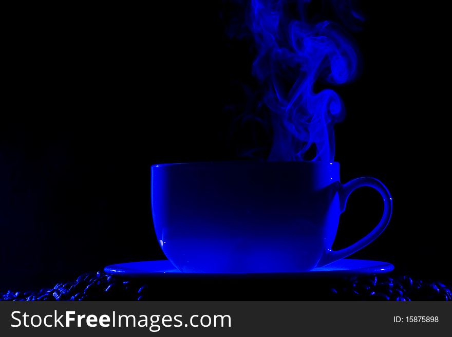 Coffee cup with steam on black background