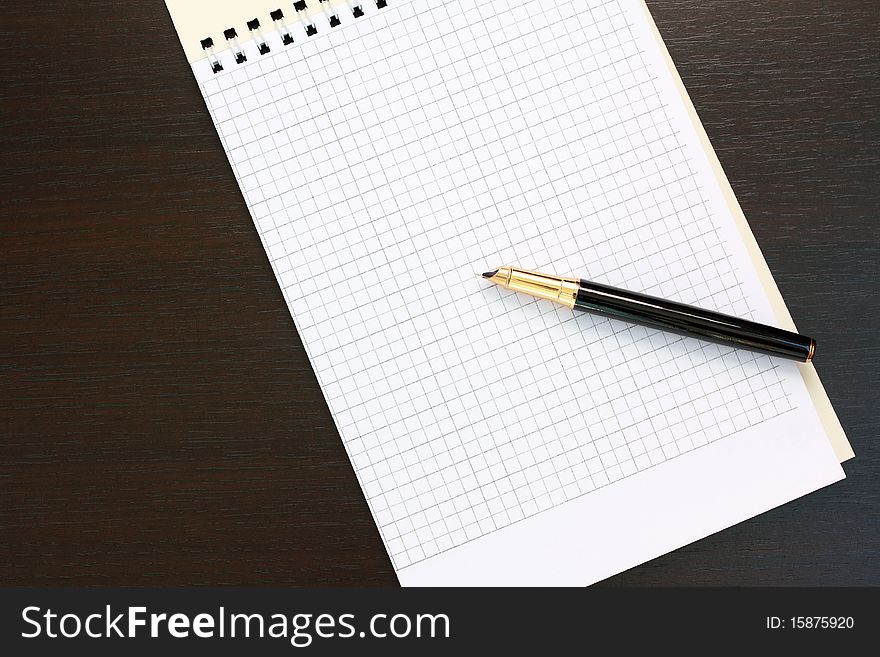 Fountain pen and notebook on the table. Fountain pen and notebook on the table