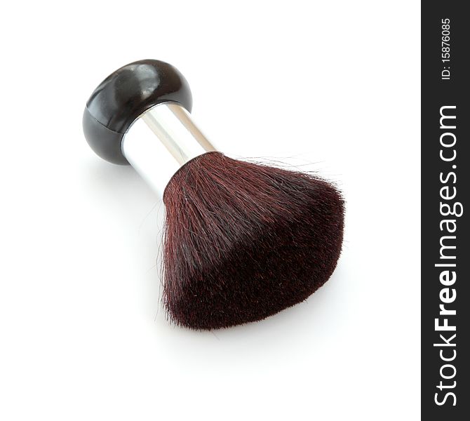 Soft cosmetic brush on a white background.