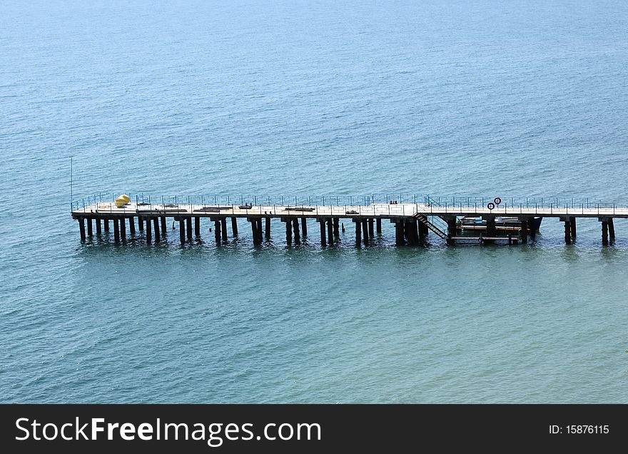 Pierce for mooring boats and yachts off the coast of Feodosia in Crimea