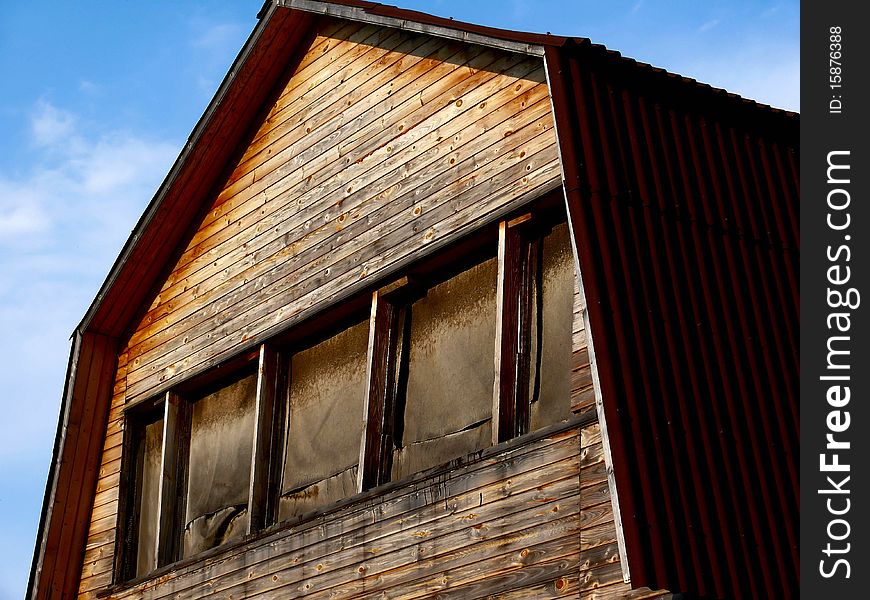 The old wooden house against the dark blue sky. The old wooden house against the dark blue sky.