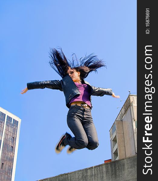 Young girl jumping to the sky. Young girl jumping to the sky