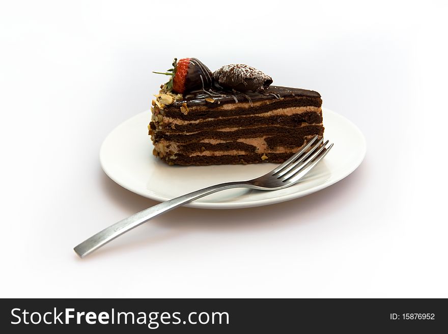 Chocolate cake on the plate in white background