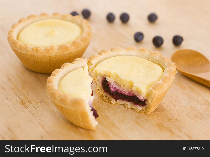 Blueberry tarts on wooden table