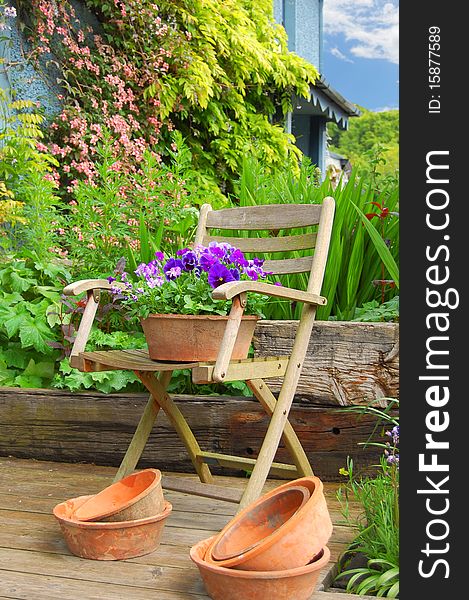 Wooden chair with a bed of flowers. Wooden chair with a bed of flowers