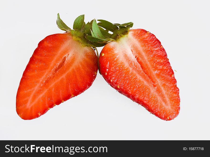Strawberry halves on a white background