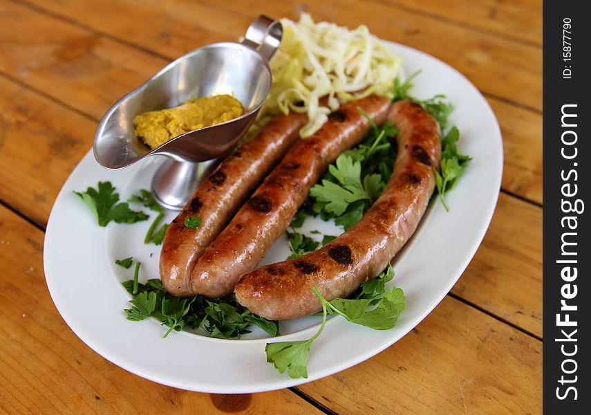 Delicious food ,sausage and cabbage with mastered. Delicious food ,sausage and cabbage with mastered