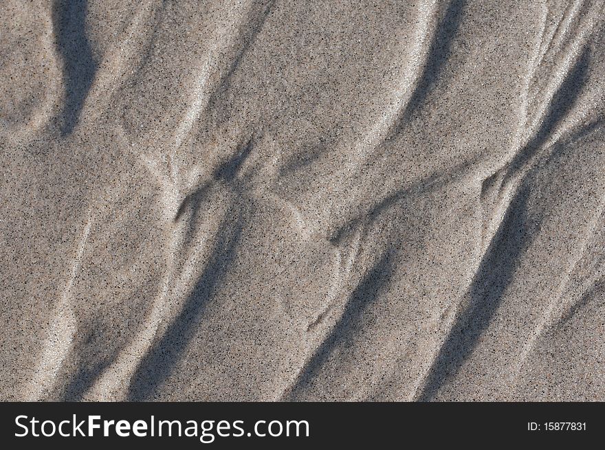 Wet sand background. Macro. Close-up