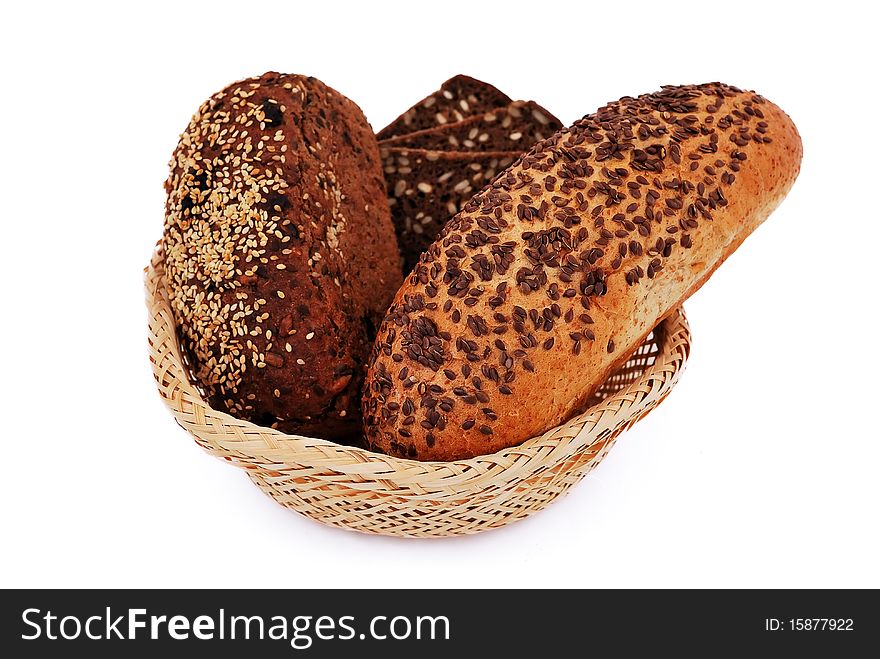 Bread with sesame seeds in a wooden basket