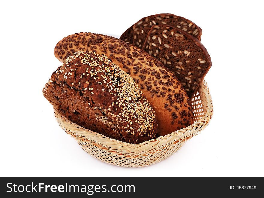 Bread with sesame seeds in a wooden basket
