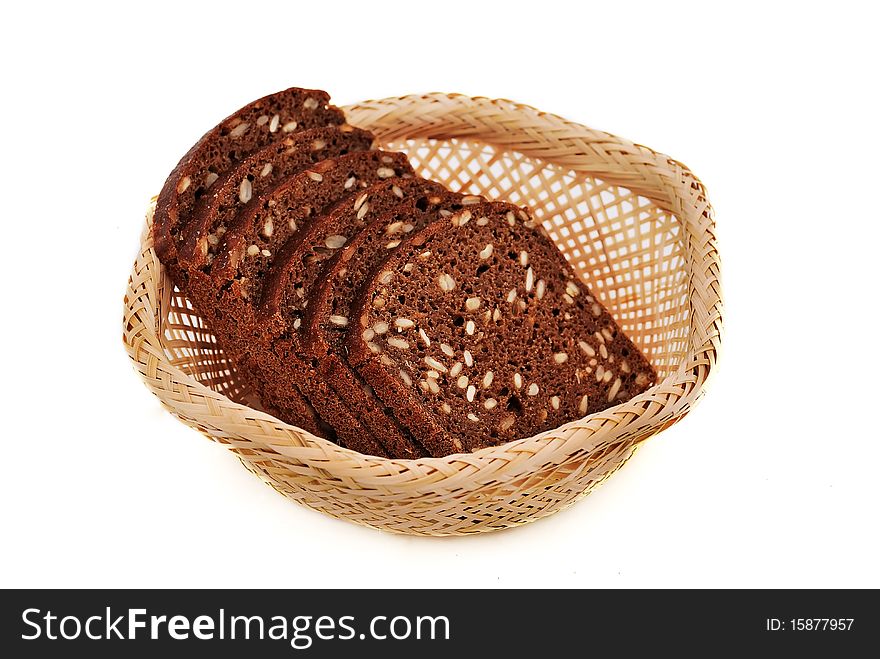 Bread with seeds in a wooden basket