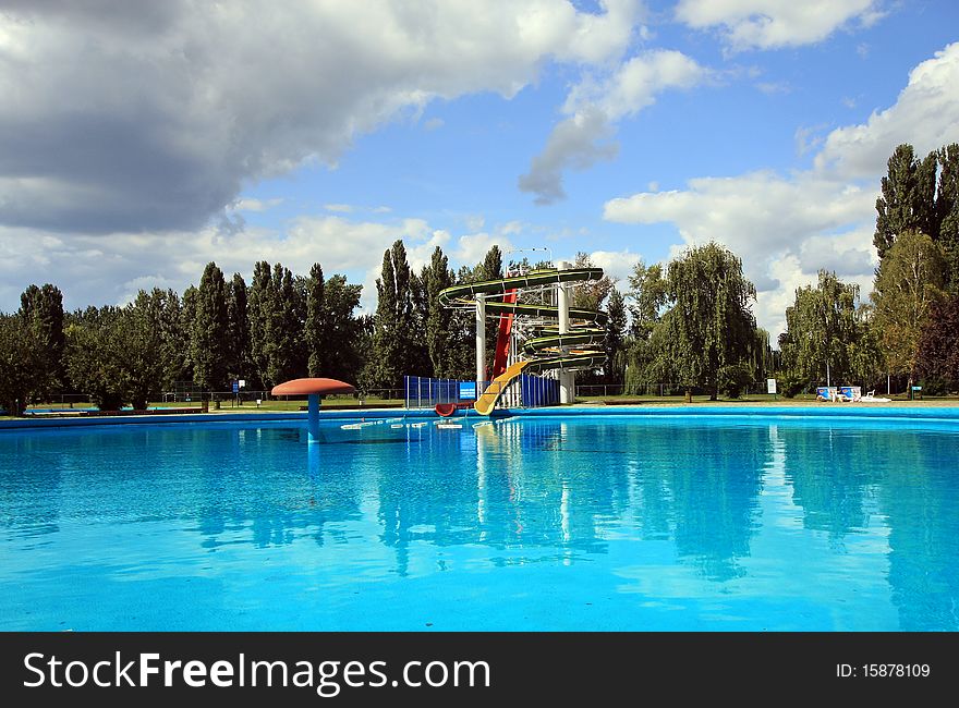 Aquatic park with water slide and the swimming pool