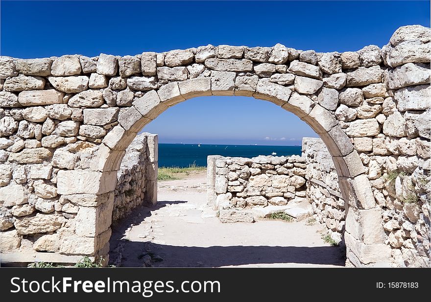 Ruins of ancient city against sea