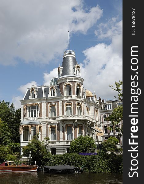 Splendid mansion in historical center of Amsterdam in summer day. Splendid mansion in historical center of Amsterdam in summer day.