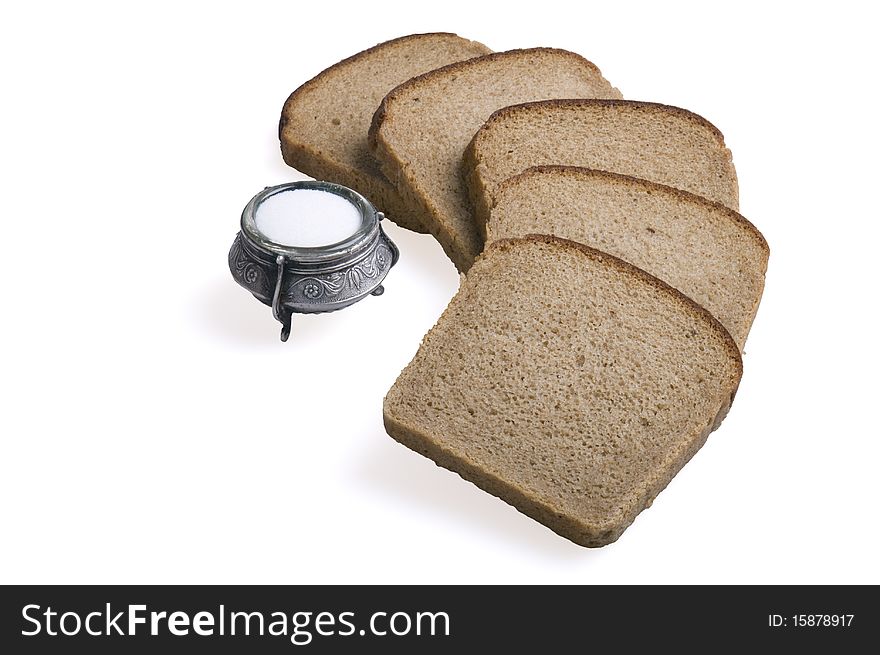 Bread and salt isolated over white background