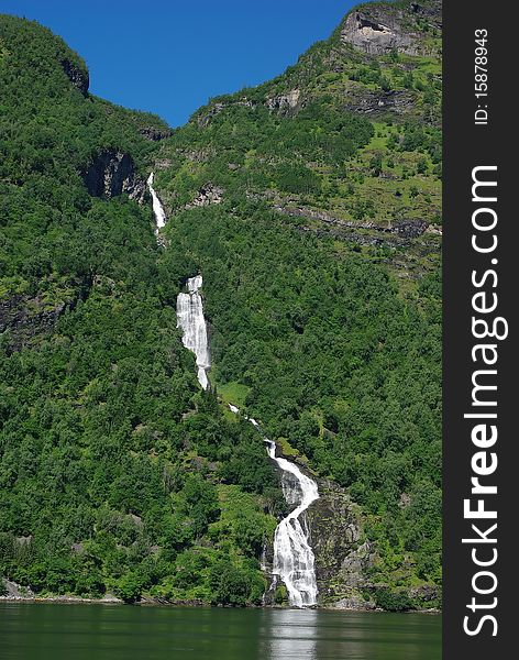 Mountain river with waterfall in Norway