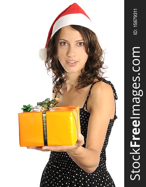 Pretty young woman with santa hat holding christmas gift. Pretty young woman with santa hat holding christmas gift