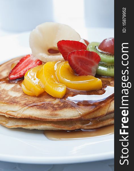 Breakfast pancakes with fruit topping