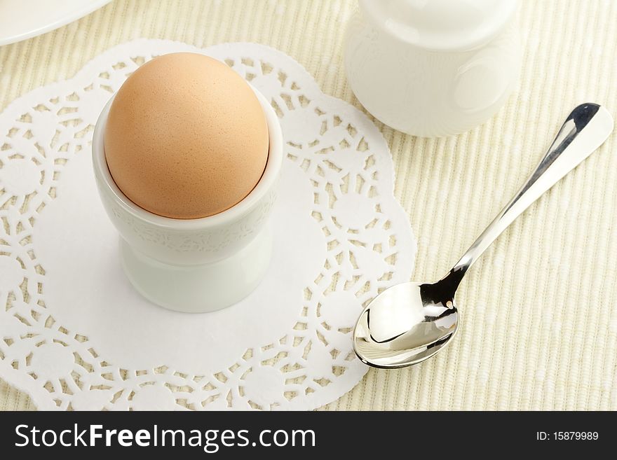 Breakfast table with boiled egg