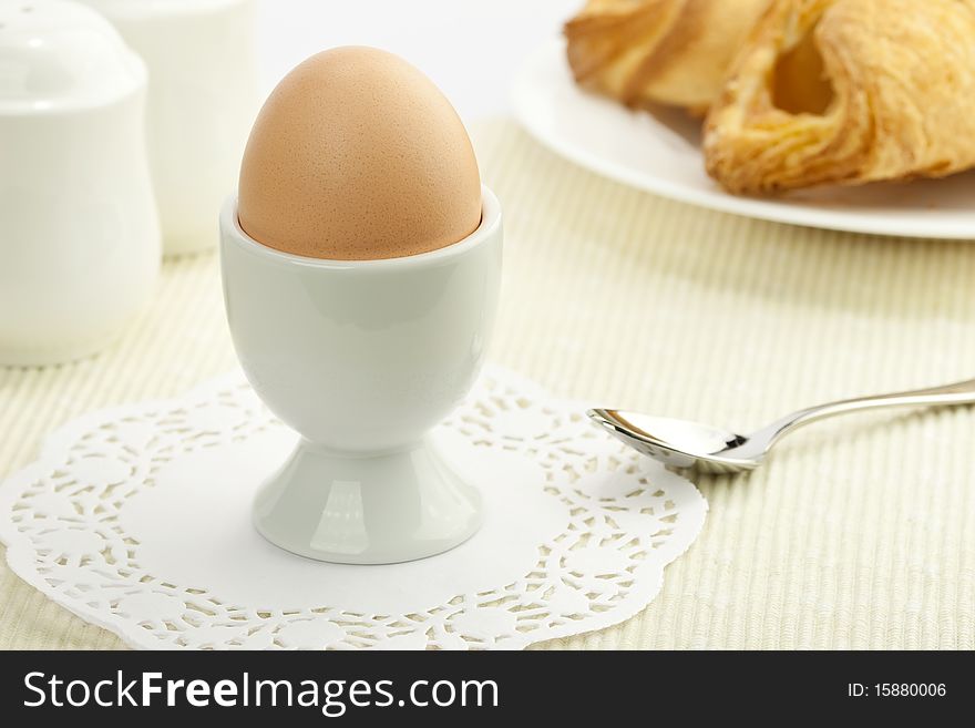 Breakfast table with a boiled egg