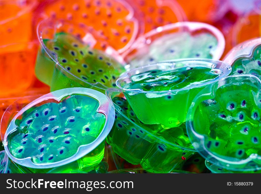 Many color jelly it make of fruit juice mix with gelatin ,it is a cool and delicious dessert. Many color jelly it make of fruit juice mix with gelatin ,it is a cool and delicious dessert