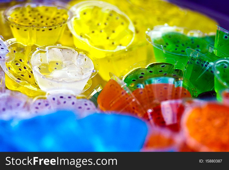 Many color jelly it make of fruit juice mix with gelatin ,it is a cool and delicious dessert. Many color jelly it make of fruit juice mix with gelatin ,it is a cool and delicious dessert