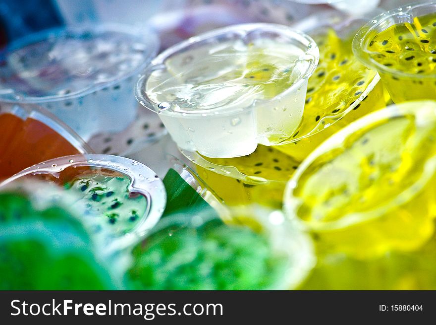 Many color jelly it make of fruit juice mix with gelatin ,it is a cool and delicious dessert. Many color jelly it make of fruit juice mix with gelatin ,it is a cool and delicious dessert