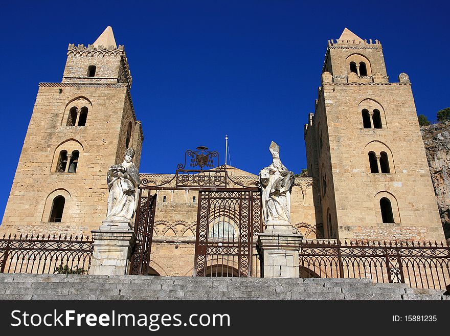 Cefalu cathedral on summer sky; Sicily