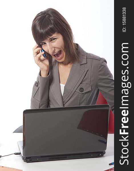 This photo shows a business woman talking on the phone.