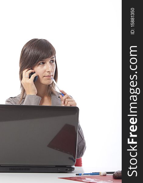 This photo shows a business woman talking on the phone.