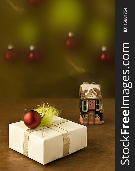 Present box with christmas decoration on a table
