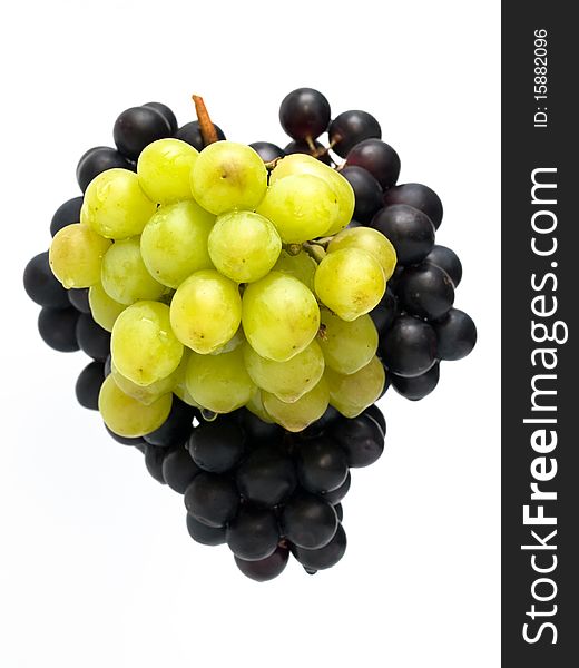 Bunch of green and black grapes isolated on white